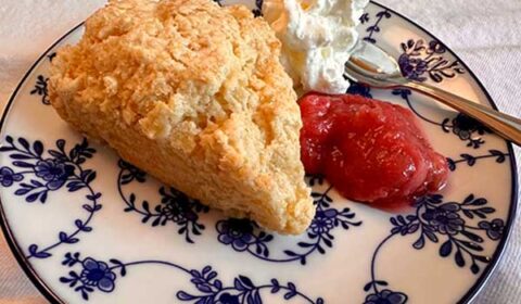 Easy cream scone with rhubarb jam and whipped cream.